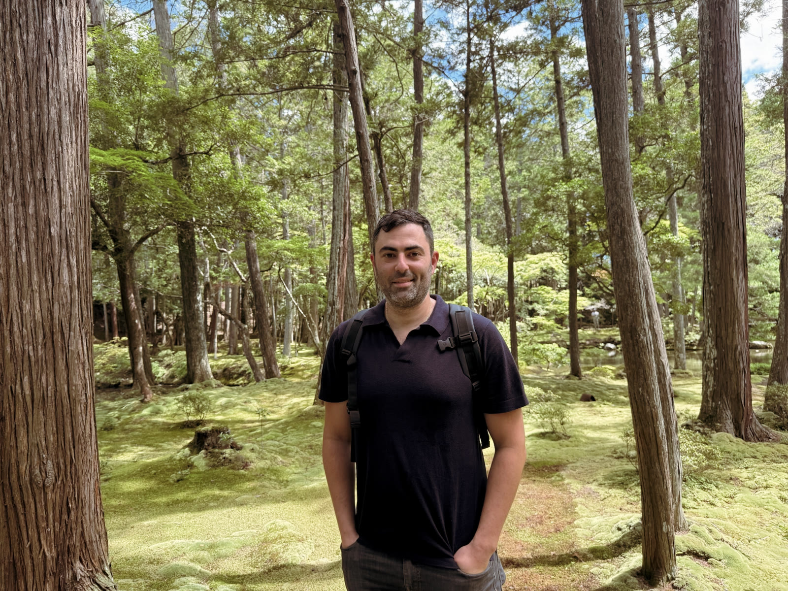 Eric Markowitz standing in a moss-covered forest